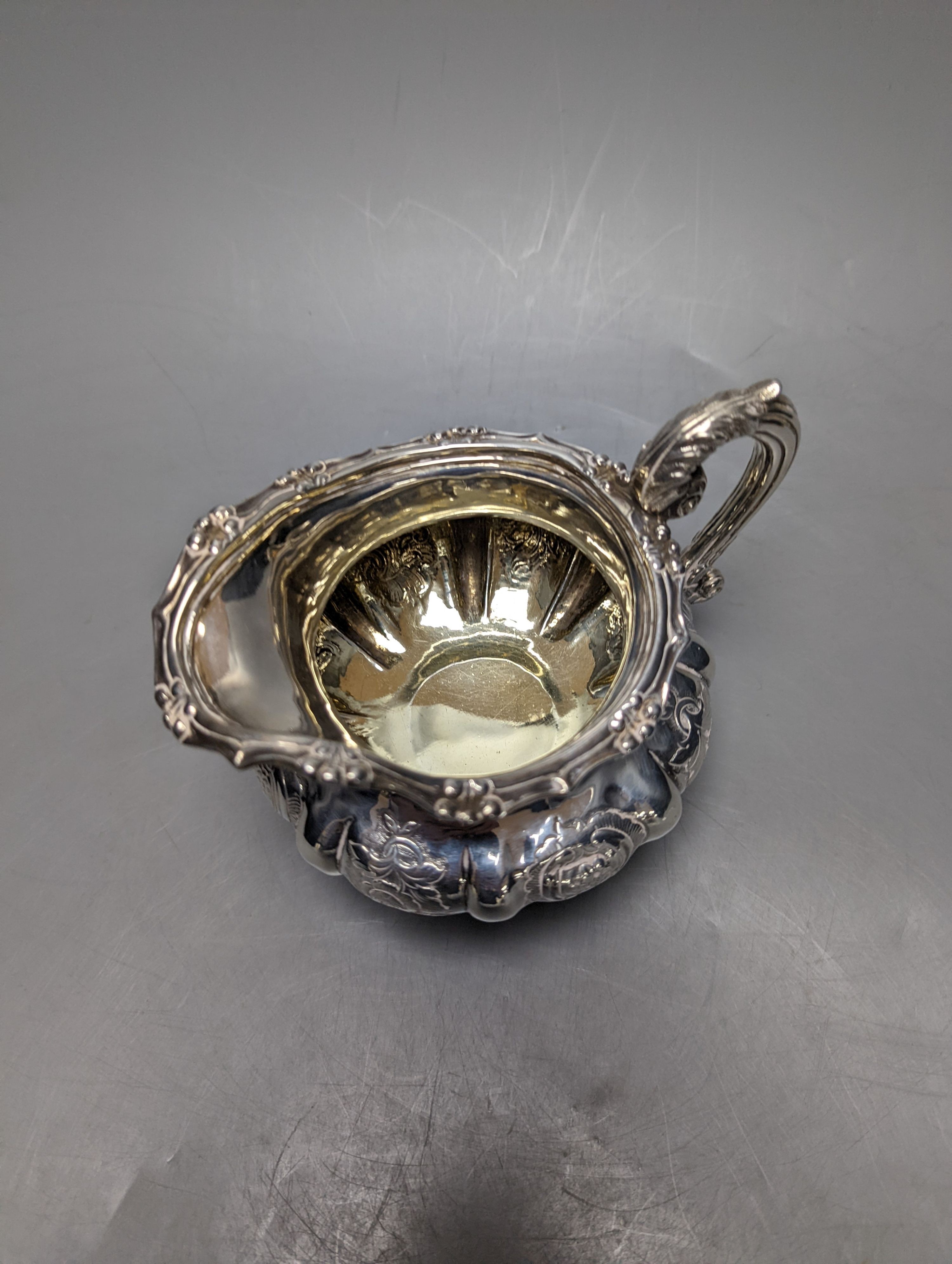 A Victorian embossed silver cream jug, J.E. Terry & Co, London, 1838, height 10.9cm